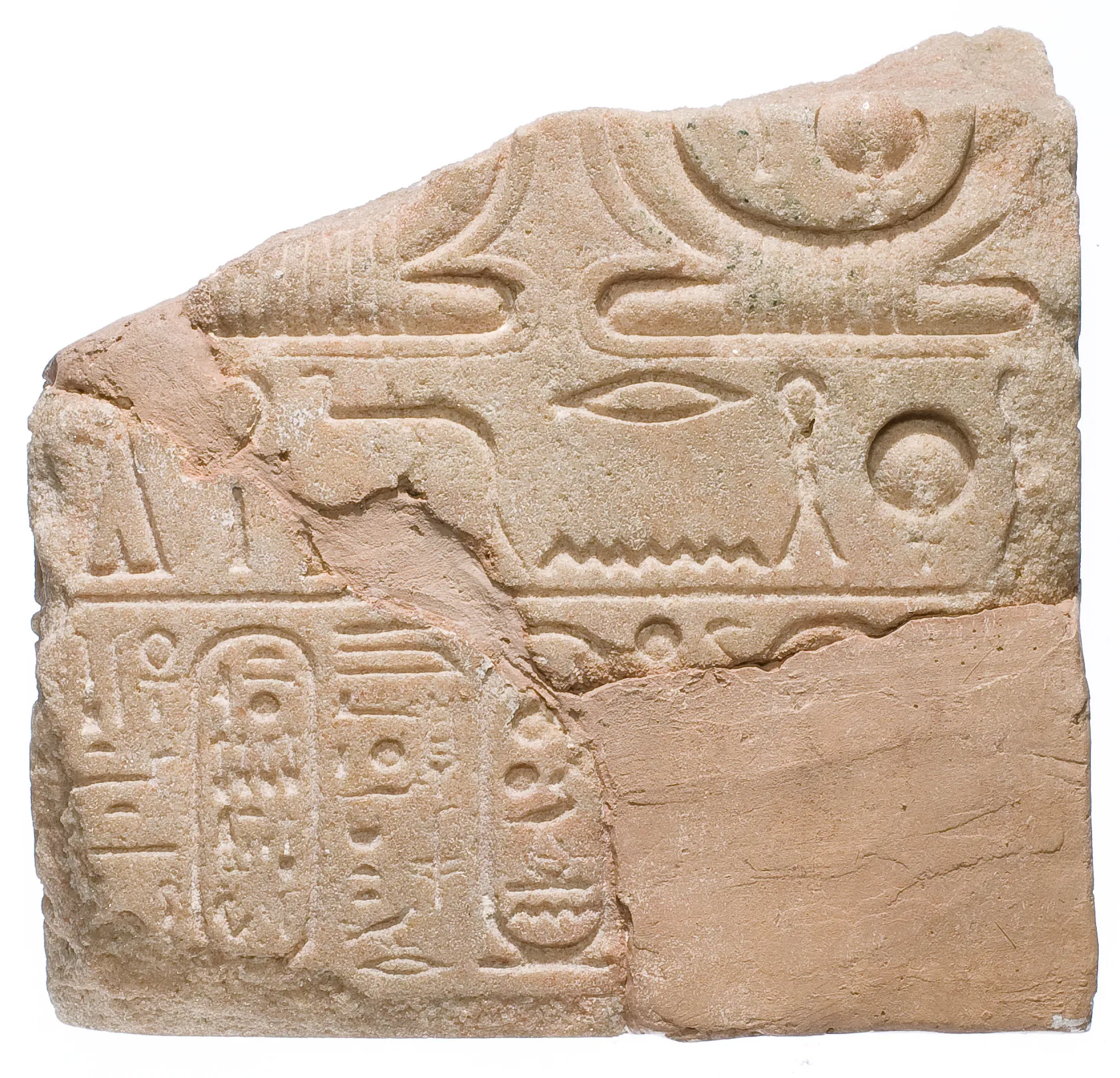 A yellow quartzite tablet inscribed with the cartouches of Aten, Akhenaten, and Nefertiti, ancient Egypt, ca. 1353 to 1336 BCE.